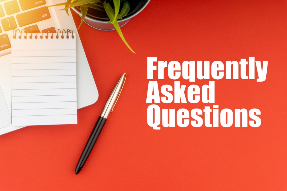 FrequentlyAskQuestionsOrFaqTextWithNotepadLaptopFountain